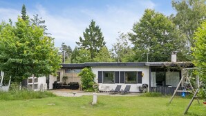 A modern house with a patio, outdoor seating, and a garden. - "Gadde" - 1km from the sea by Interhome (Hundested)
