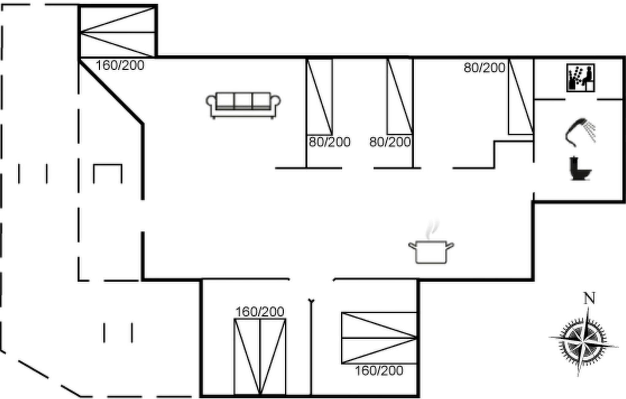 A floor plan with a kitchen, two bathrooms, a dining area, and a living room with a sofa.