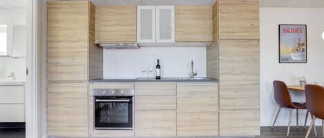 Fridge, oven, highchair, cookware/dishes/utensils