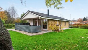 A modern two-story house with a covered patio and a well-maintained lawn. - "Umen" - 300m from the sea by Interhome (Sydals)