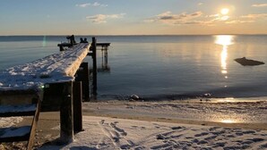 A pier extending into calm water with a sunset in the background. - "Leefke" - 300m from the sea by Interhome (Sydals)