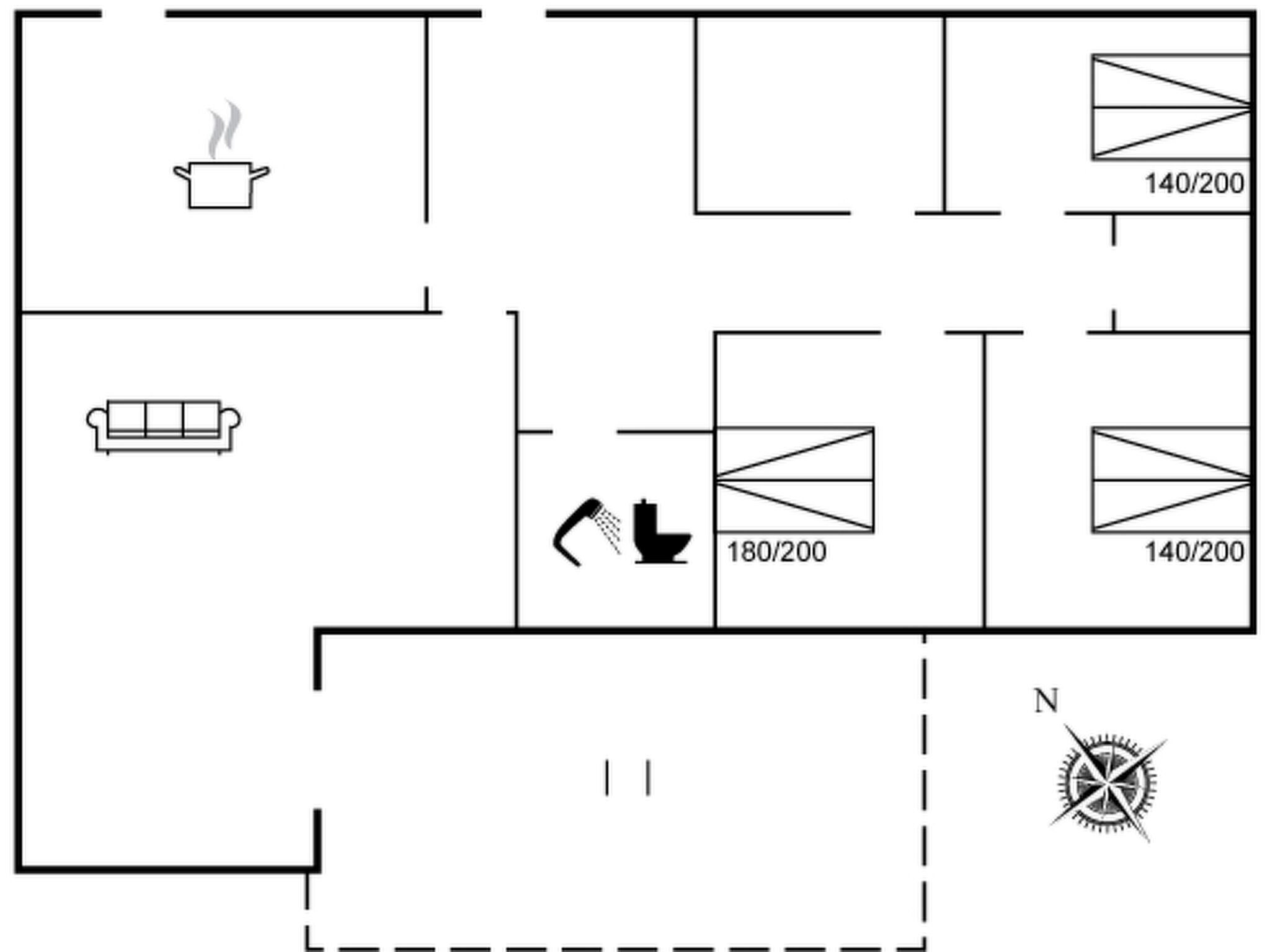 A floor plan with a kitchen, a living area with a sofa, and a bathroom with a shower.