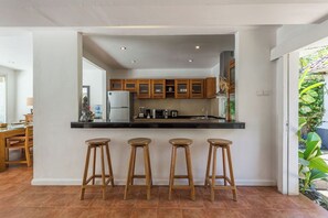 Fridge, microwave, stovetop, coffee/tea maker