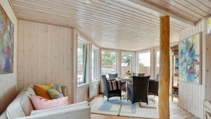 A cozy room with a sofa, chairs, a table, and artwork on the walls. - "Sigurd" - 20m from the sea by Interhome (Middelfart)
