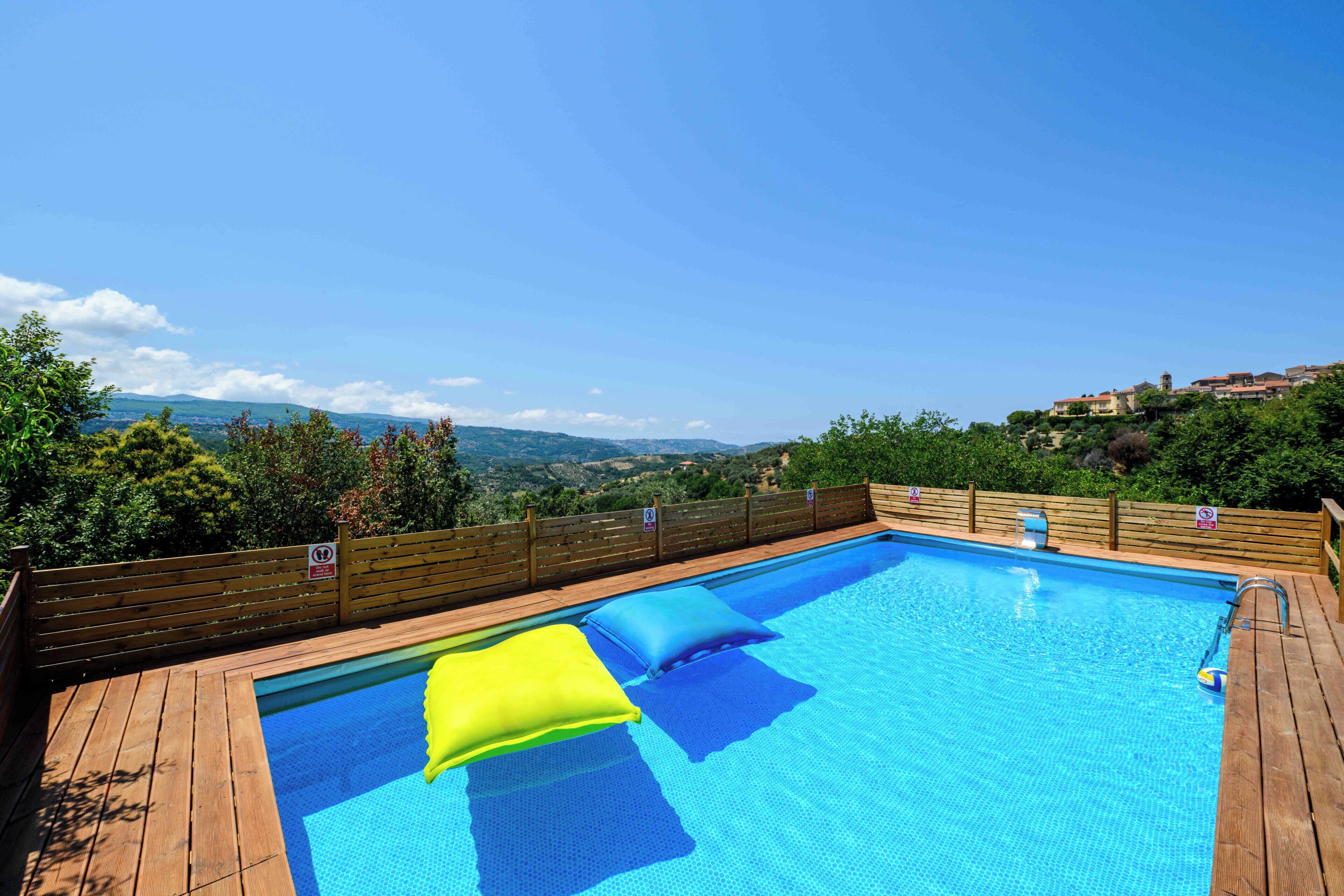 Seasonal outdoor pool, open 9:00 AM to 6:30 PM, pool umbrellas