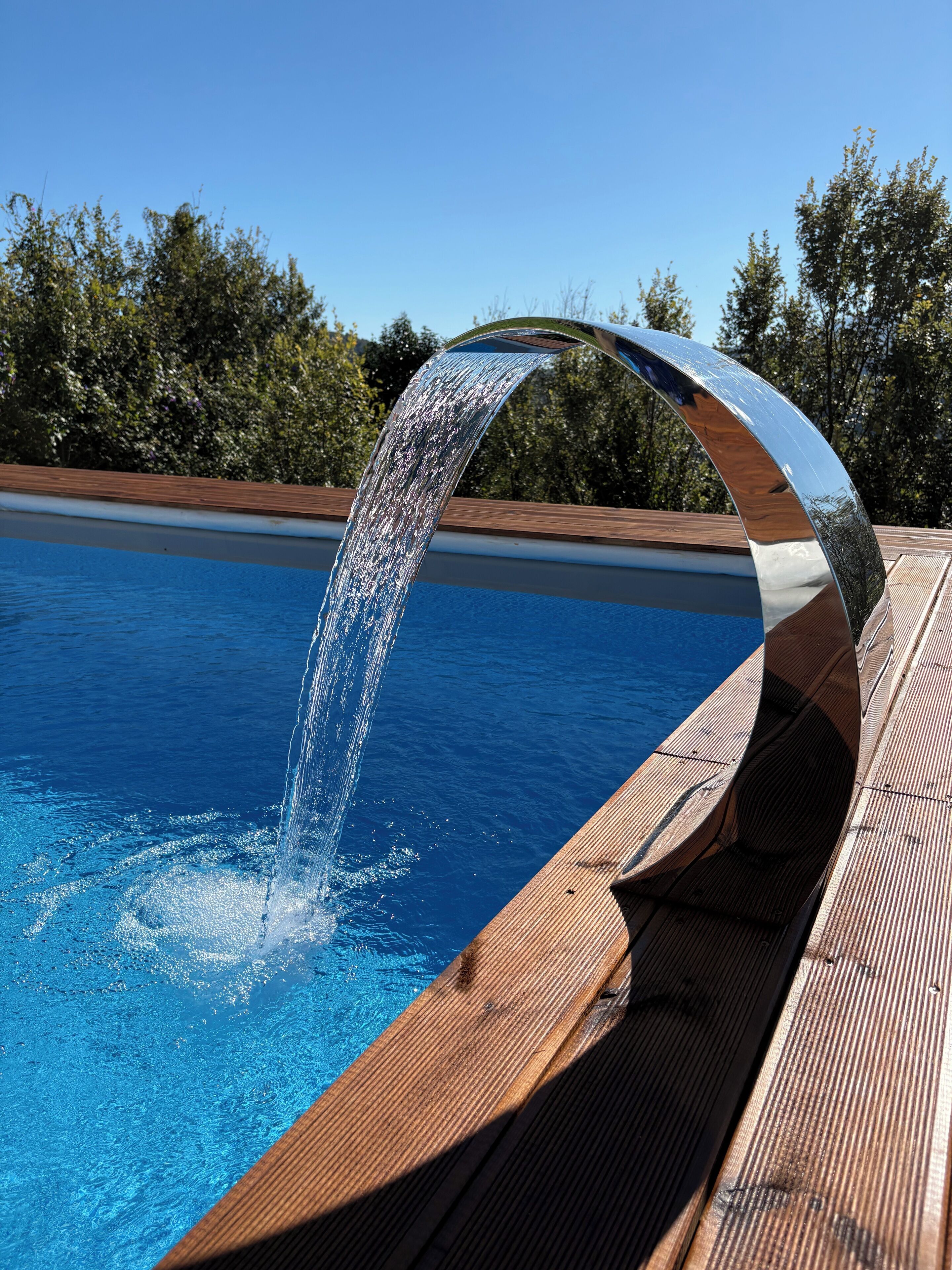 Seasonal outdoor pool, open 9:00 AM to 6:30 PM, pool umbrellas