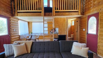 Cabin | Living area | 70-inch flat-screen TV with digital channels, fireplace, DVD player