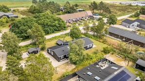 A residential area with houses, a parking lot, and a view of the ocean. - "Riekje" - 2.3km from the sea by Interhome (Rømø)