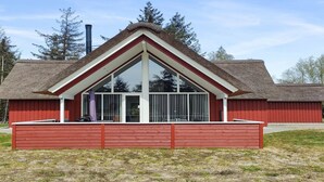 A red wooden building with a triangular roof and large windows. - "Lima" - 3.5km from the sea by Interhome (Rømø)