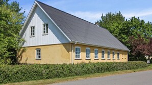 A two-story house with a gabled roof and a yellow facade. - "Lokke" - 19km from the sea by Interhome (Skærbæk)