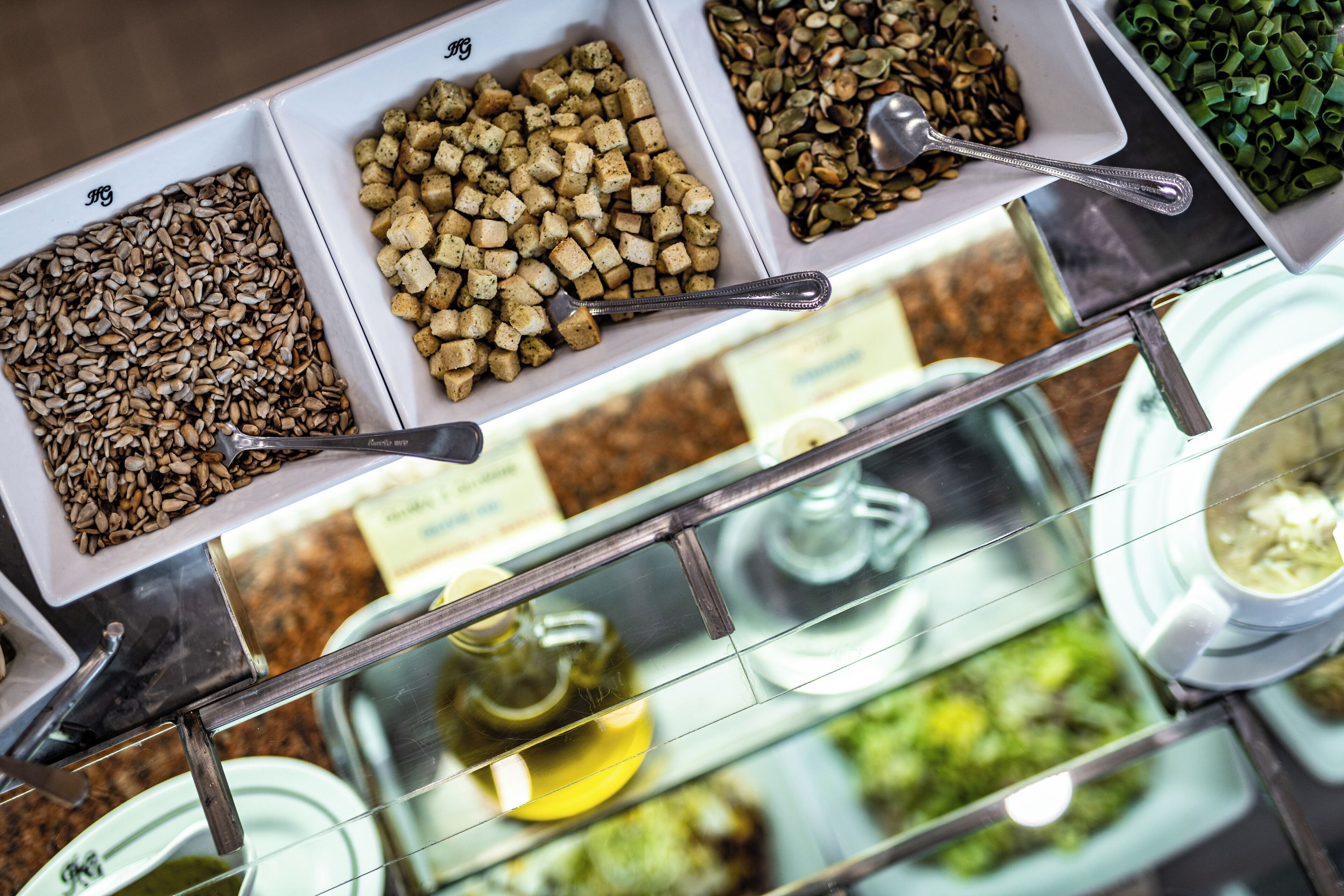 A food display with various nuts and seeds.