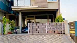 A modern hotel building with a sign reading "HOTEL MOCK ORANGE". - Hotel Mock Orange (Jaipur)