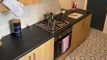 Fridge, microwave, toaster, cookware/dishes/utensils