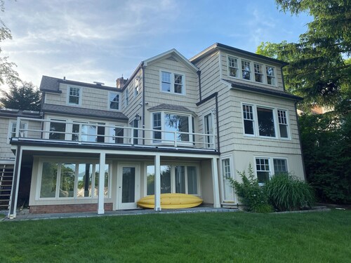 Stunning waterfront house with dock, walk to shops, restaurants, beach, train. 