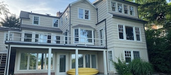 Stunning waterfront house with dock, walk to shops, restaurants, beach, train.