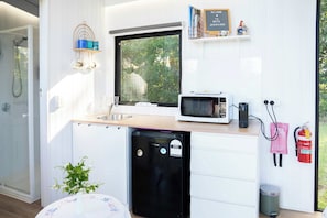 Fridge, microwave, stovetop, coffee/tea maker - White Jacaranda Tiny House by Tiny Away (Maleny)