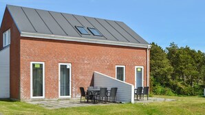 A modern brick building with a sloped roof and skylights. - "Aya" - 2.3km from the sea by Interhome (Rømø)