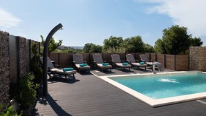 A rooftop pool area with lounge chairs and a water feature. - Kala in Razanac With 4 Bedrooms and 2 Bathrooms (Razanac)
