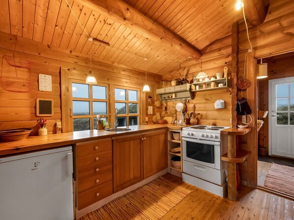 Fridge, oven, highchair, cookware/dishes/utensils