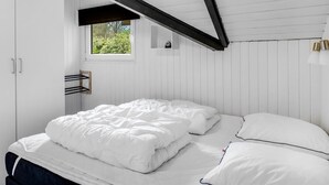 A bedroom with a bed, a window, and a wardrobe. - "Liljana" - 30km from the sea by Interhome (Toftlund)