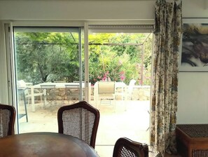 Enjoy casual dining or relaxation on the patio with a clear view of the outdoor setting.