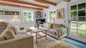A cozy living room with a fireplace, a television, and a dining area. - "Tatiane" - 10km from the sea by Interhome (Bækmarksbro)