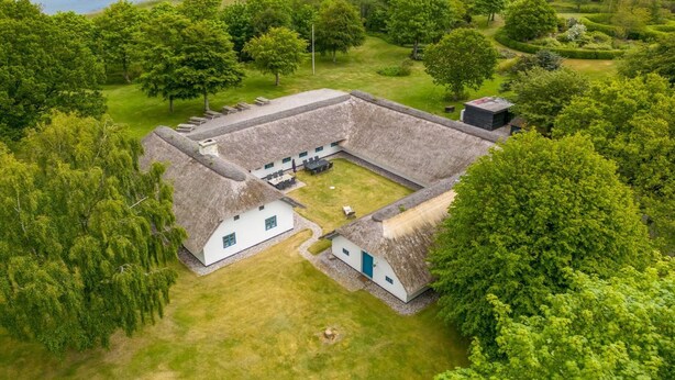 An aerial view of a historic building with a courtyard, surrounded by lush greenery and a river in the background. - "Tatiane" - 10km from the sea by Interhome (Bækmarksbro)