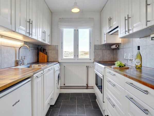 Fridge, oven, high chair, cookware/dishes/utensils