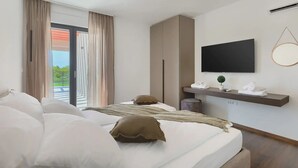 A modern hotel room with a large bed, a TV mounted on the wall, and a balcony with curtains. - Artsi in Svetvin Enat (Svetvincenat)