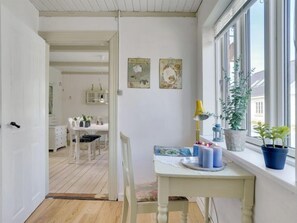 Enjoy a spacious room with a dining area, a cozy reading nook, and a window offering a view of the outside.