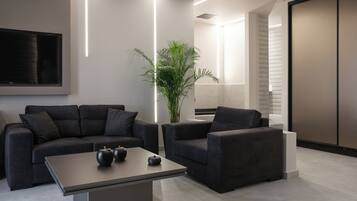 Luxury Suite | Living area | Flat-screen TV