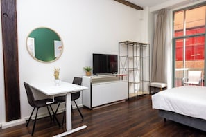 Enjoy a comfortable stay in this stylish room with a flat-screen TV, desk, and large window offering a view.
