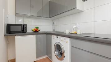 Fridge, microwave, stovetop, cookware/dishes/utensils