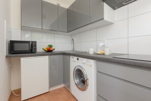 Fridge, microwave, stovetop, cookware/dishes/utensils