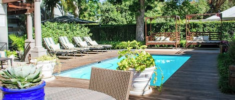 Outdoor pool, pool umbrellas, pool loungers