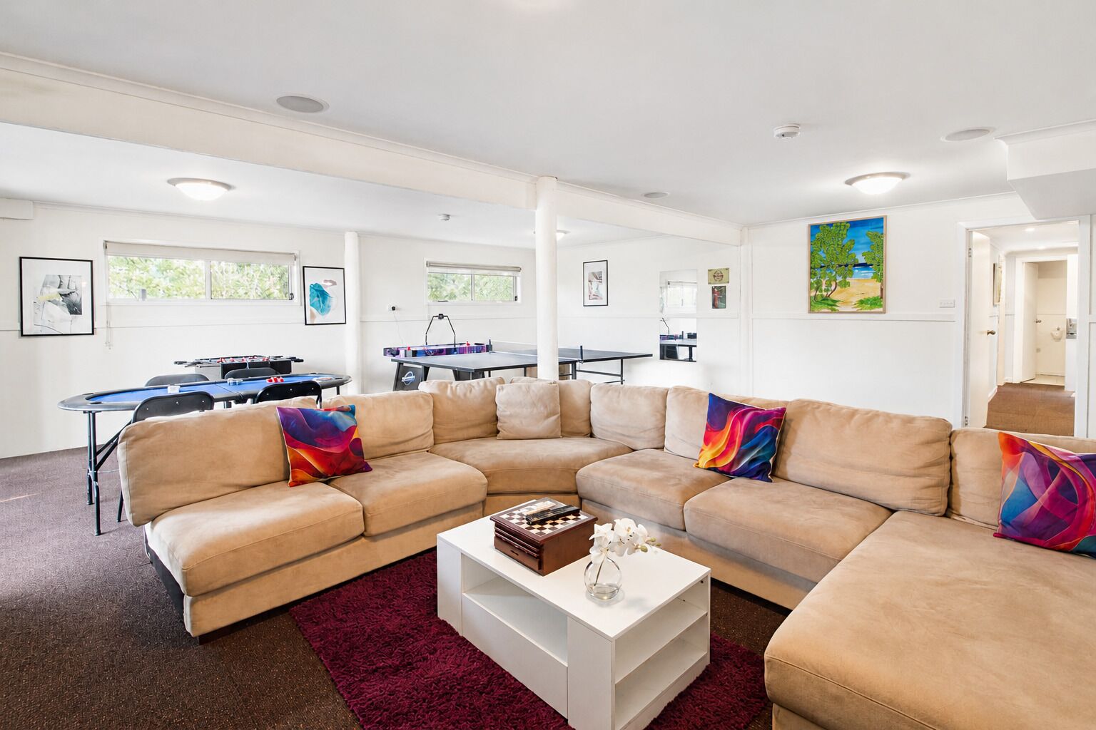 Living Room 2 : Stretch out in the downstairs games lounge at Carlenes Getaway, with a large sofa, table tennis and space to unwind after Loch Sport beach days.