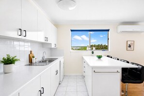 Coffee/tea maker, fridge, microwave, oven