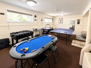 A room with a pool table, foosball table, and ping pong table. - Carlenes Getaway | Lake Views, Beach & Games Hub (Loch Sport)