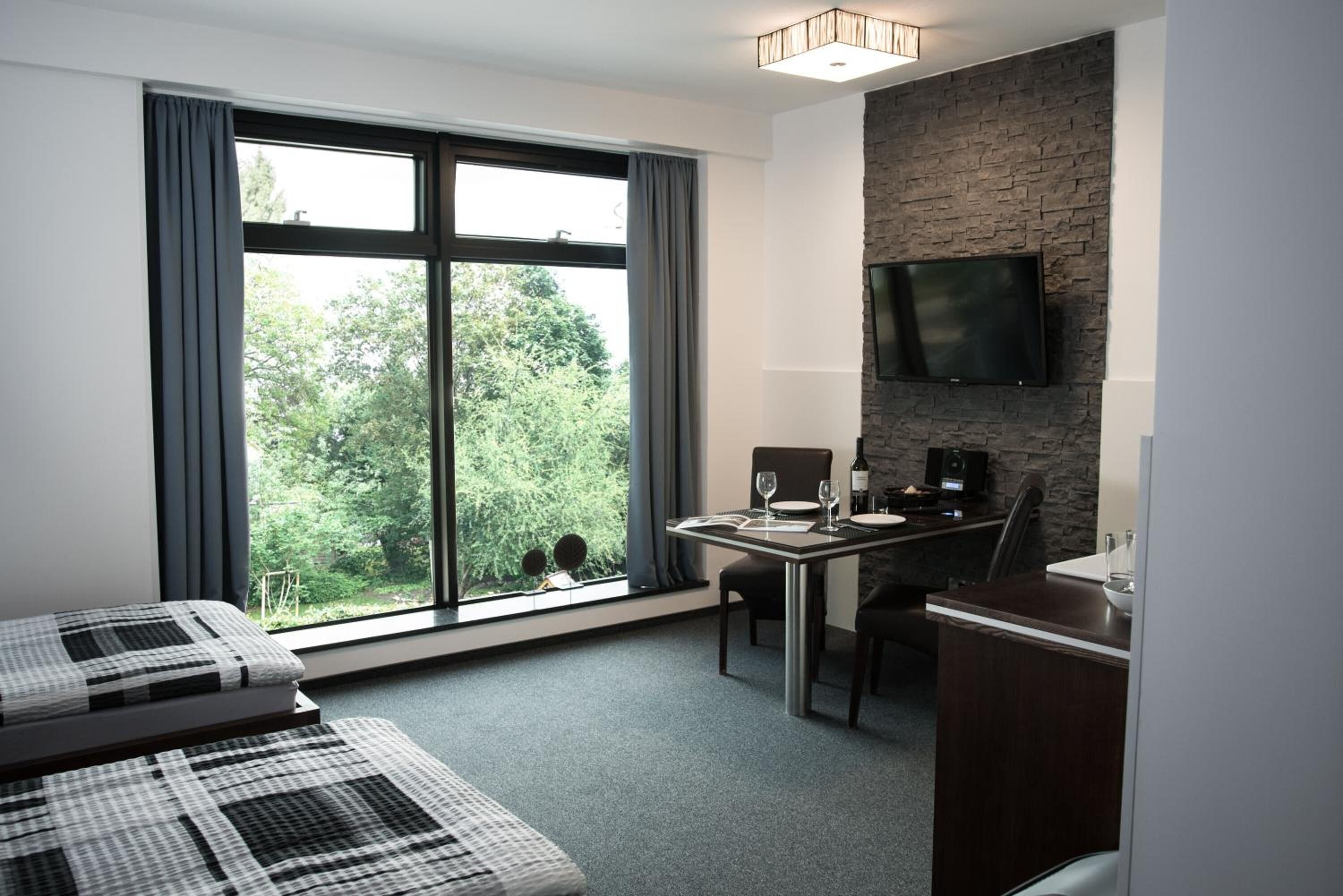 3 bedrooms, blackout drapes, soundproofing, iron/ironing board