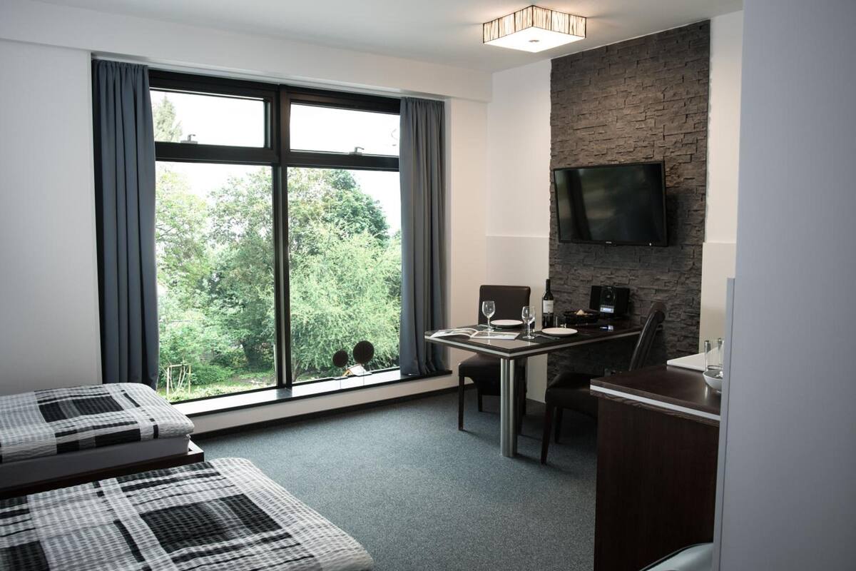 3 bedrooms, blackout curtains, soundproofing, iron/ironing board
