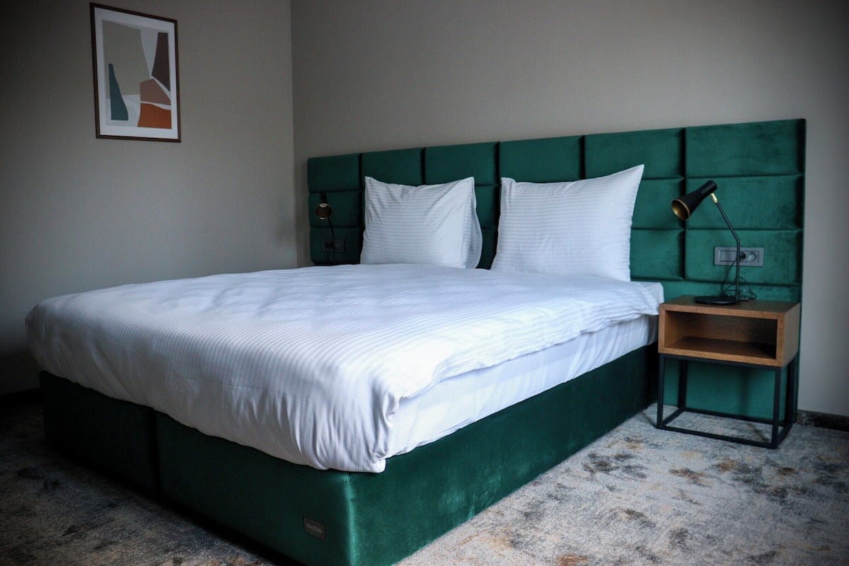 Deluxe Suite, 2 Bedrooms | In-room safe, desk, laptop workspace, soundproofing