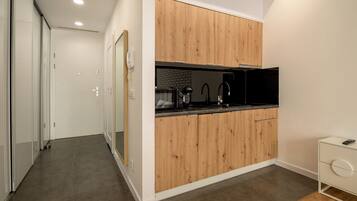Suite estudio | Cocineta privada | Refrigerador, microondas, parrilla de estufa y lavavajillas