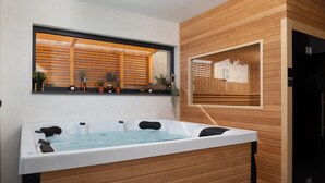 A modern bathroom with a wooden wall, a large bathtub, and a mirror above it. - Soho in Starigrad With 6 Bedrooms and 6 Bathrooms (Starigrad)