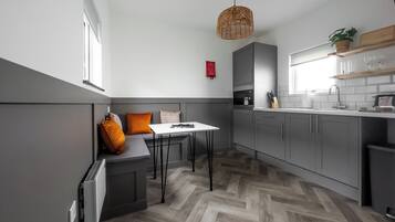 Holiday Lodge | Private kitchen | Fridge, microwave, stovetop, electric kettle