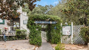 A coastal entrance with a sign reading "COASTSIDE SOA" and a decorative archway. - Gulf/Beachfront Condo | Private Beach (Santa Rosa Beach)