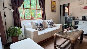 Family Cottage, 2 Bedrooms, Terrace, Mezzanine | Living area | 32-inch flat-screen TV with digital channels