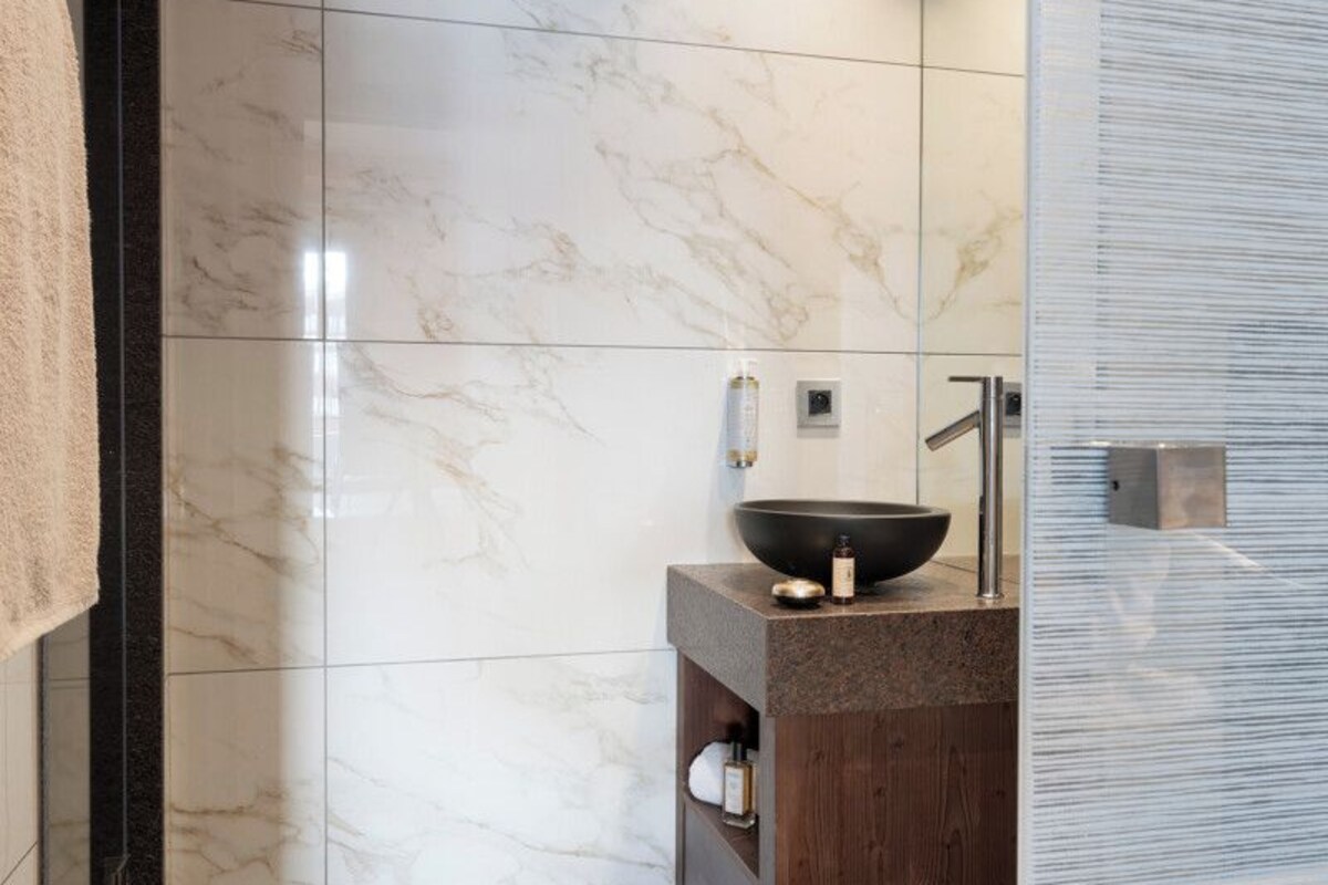 Bathroom | Hair dryer, bathrobes, slippers, towels