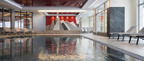 Indoor pool, open 10:00 AM to 8:00 PM, pool loungers