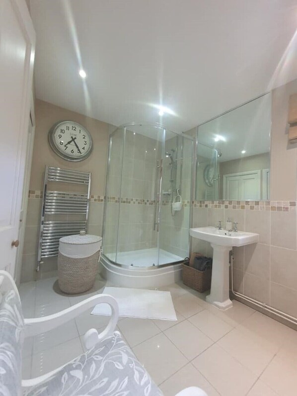 Shower, hair dryer, towels, soap