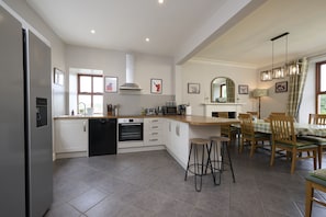 Enjoy casual meals at the central island or formal gatherings around the dining table.